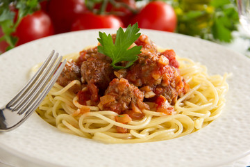 Pasta with meatballs in tomato sauce.
