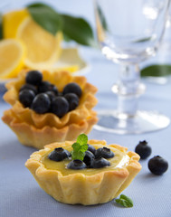 Delicious tarts with lemon cream and blueberries.