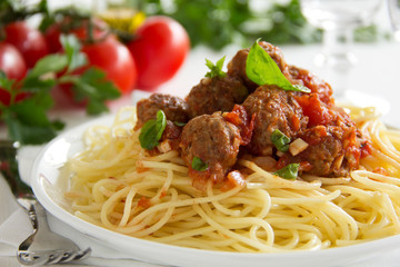 Pasta with meatballs in tomato sauce.