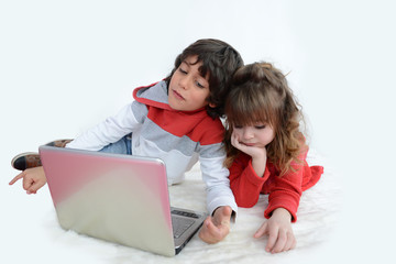 Boy and girl watching laptop screen