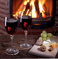 Glasses of wine, cheese and nuts.