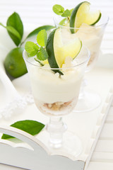 Cheesecake with lime in a glass. Selective focus.