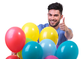 happy man behind a baloons bunch making ok