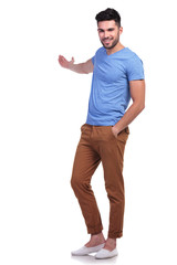 Fototapeta premium young casual man presenting something