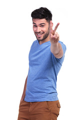 Naklejka premium happy casual man making the victory sign