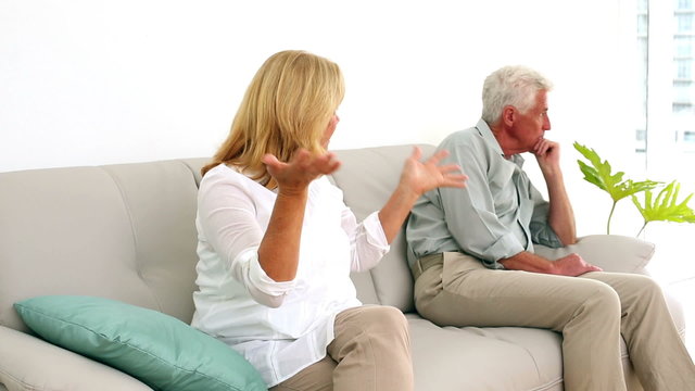 Retired couple fighting on the couch