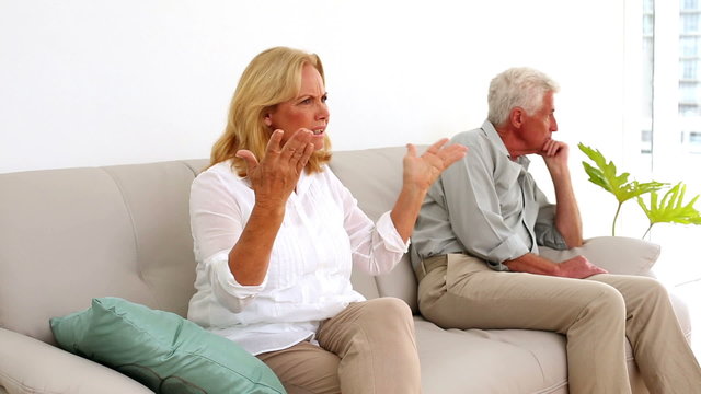 Retired couple fighting on the couch