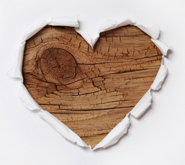Wooden Heart. Paper Hole Ripped in Heart Shape with Old Wood