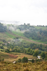 Autumn mountain landscape with fog