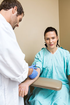 Patient With Doctor Drawing Blood From Her Arm