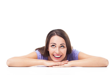 Woman leaning on table, looking up