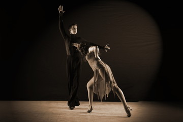 Obraz na płótnie Canvas dancers in ballroom isolated on black background
