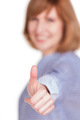 happy middle aged woman showing a thumb up sign isolated