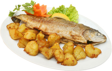 Grilled fish on BBQ with potatoes and vegetables