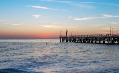 Fototapeta premium sea ​​and a pier at sunset