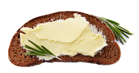 Slice of rye bread with butter, isolated on white