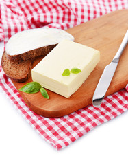 Slice of rye bread with butter, isolated on white