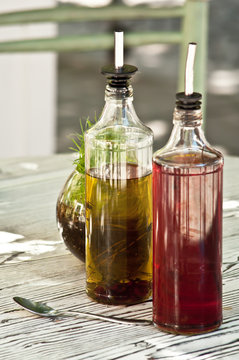 Bottles of olive oil and vinegard at table