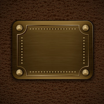 Metal badge on brown leather background