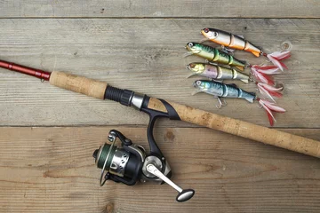Poster colorful lures with the fishing rod on the wooden pier © vkara