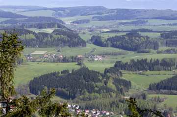 Fototapeta premium Aerial view presenting beautiful pattern of hills, fields, fores