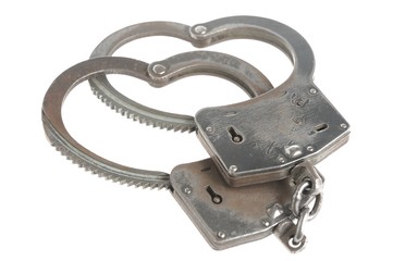 Obraz premium Handcuffs in heart shape isolated