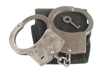 Handcuffs with key and ñase on white