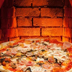 Foto op Canvas pizza with ham, mushroom and brick wall of oven © vvoe