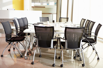Chairs Arranged Around Empty Boardroom Table