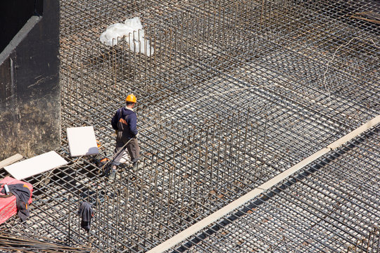 Workers Make Reinforcement For Concrete Foundation