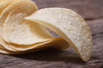 fresh fried potato chips macro on an old table close up