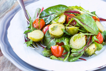 Healthy salad with brussels sprouts cabbage , tomatoes, salad