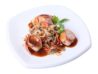 pork in bacon with mushroom garnish
