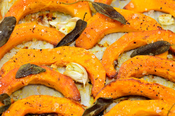 Baked butternut squash and herbs.Roasted vegetables