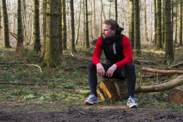 A man taking a rest from running