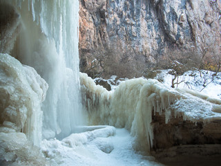 Falling water stream has formed ice crust