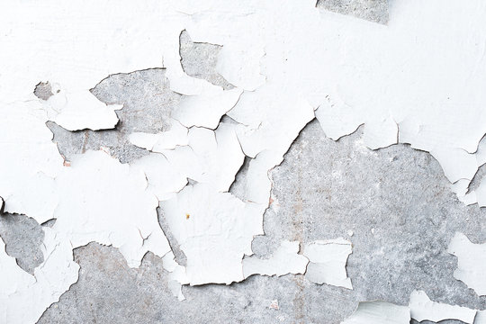 wall with peeling white paint