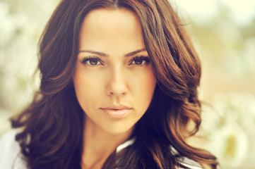 Fototapeta premium Outdoor portrait of amazing brown hair beautiful woman