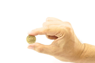 Naklejka na ściany i meble Hand of man holding gold coin