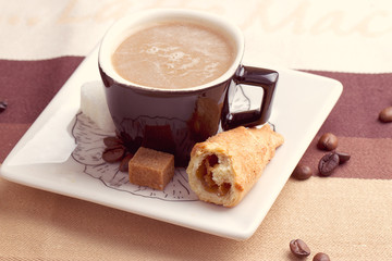 Coffee served with croissant