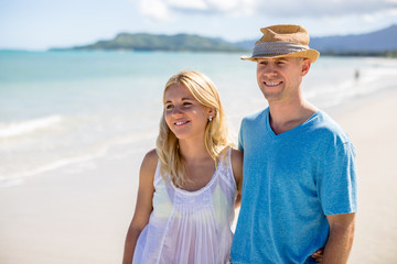 Caucasian couple lovers on beach walking