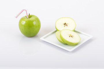 real apple juice and sliced apple on plate