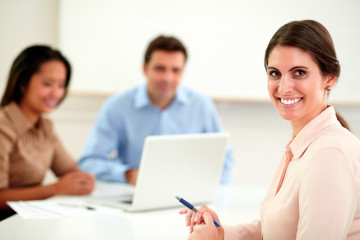 Fototapeta premium Beautiful businesswoman looking and smiling at you