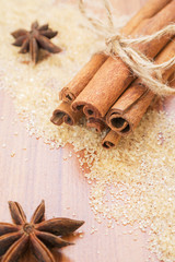 Star anise and cinnamon sticks on brown sugar