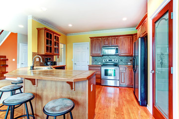 Small yellow and brown kitchen room