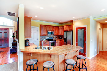 Small yellow and brown kitchen room