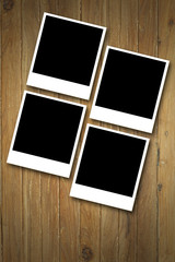 Blank photos over Wood background..