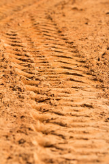 Close up  trace of a tyre in the sand