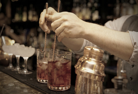 Bartender is stirring cocktails