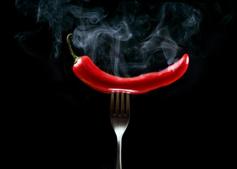 hot red pepper on fork